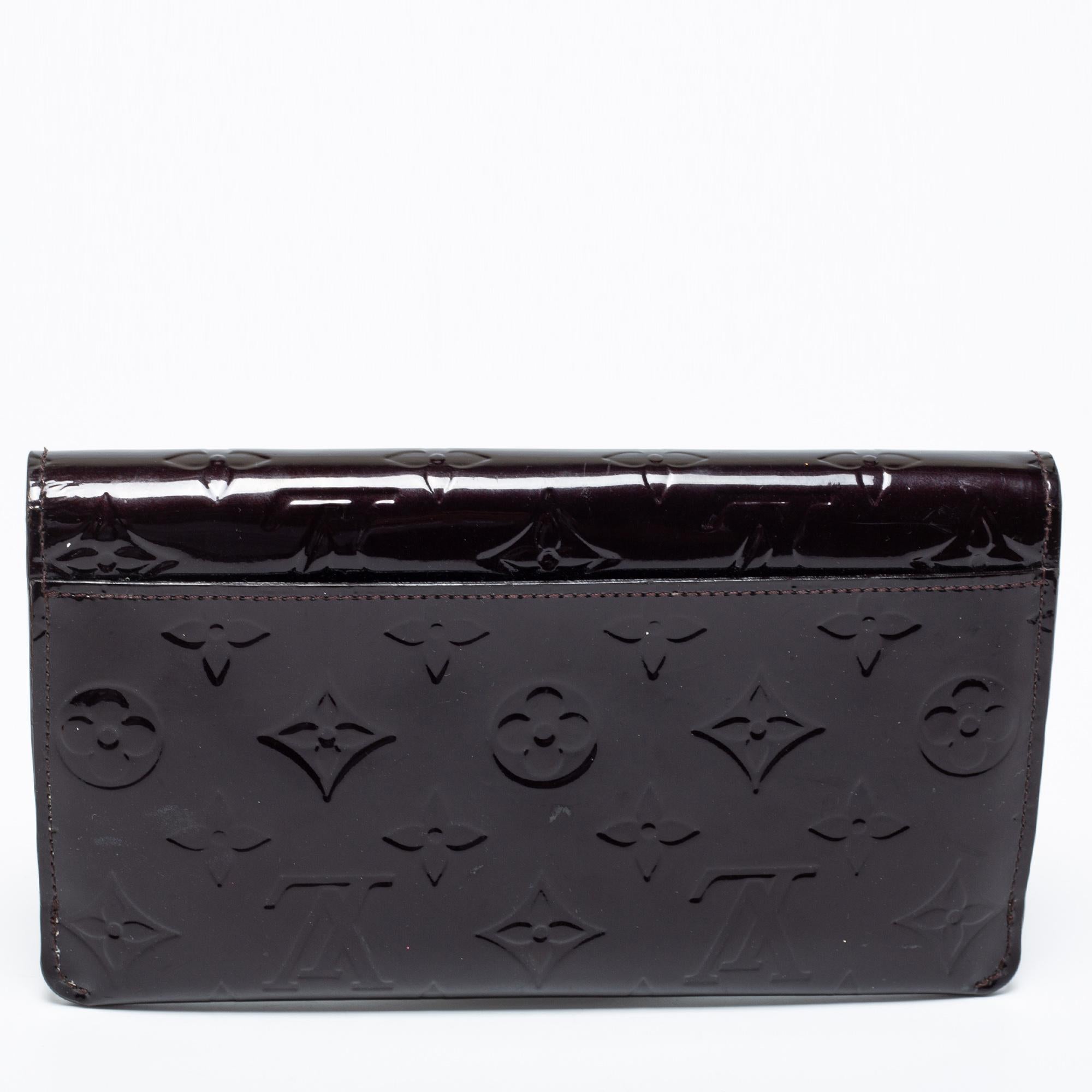 Made using Monogram Vernis, this continental wallet from Louis Vuitton has a simple look and functional quality. The flap opens to a sleek interior featuring a zip pocket and card slots.

Includes: Info Booklet, Pouch