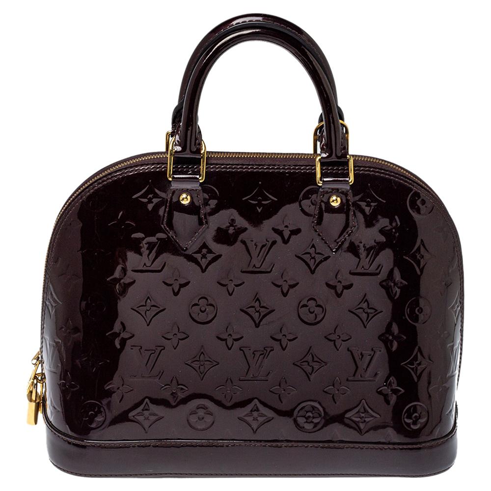 A classic from the house of Louis Vuitton, the shape of the Alma stands out. It was named after the Alma Bridge that connects Paris's fashionable neighborhood. The bag is crafted from monogram Vernis leather, and it features protective metal feet