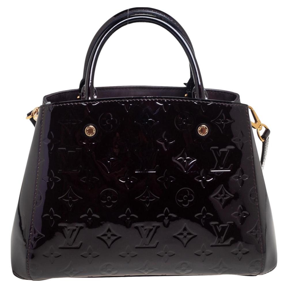 A handbag should not only be good-looking but also functional, just like this Montaigne BB bag from Louis Vuitton. Crafted from Monogram Vernis leather, this gorgeous number has a spacious fabric interior that comes with two open compartments and a