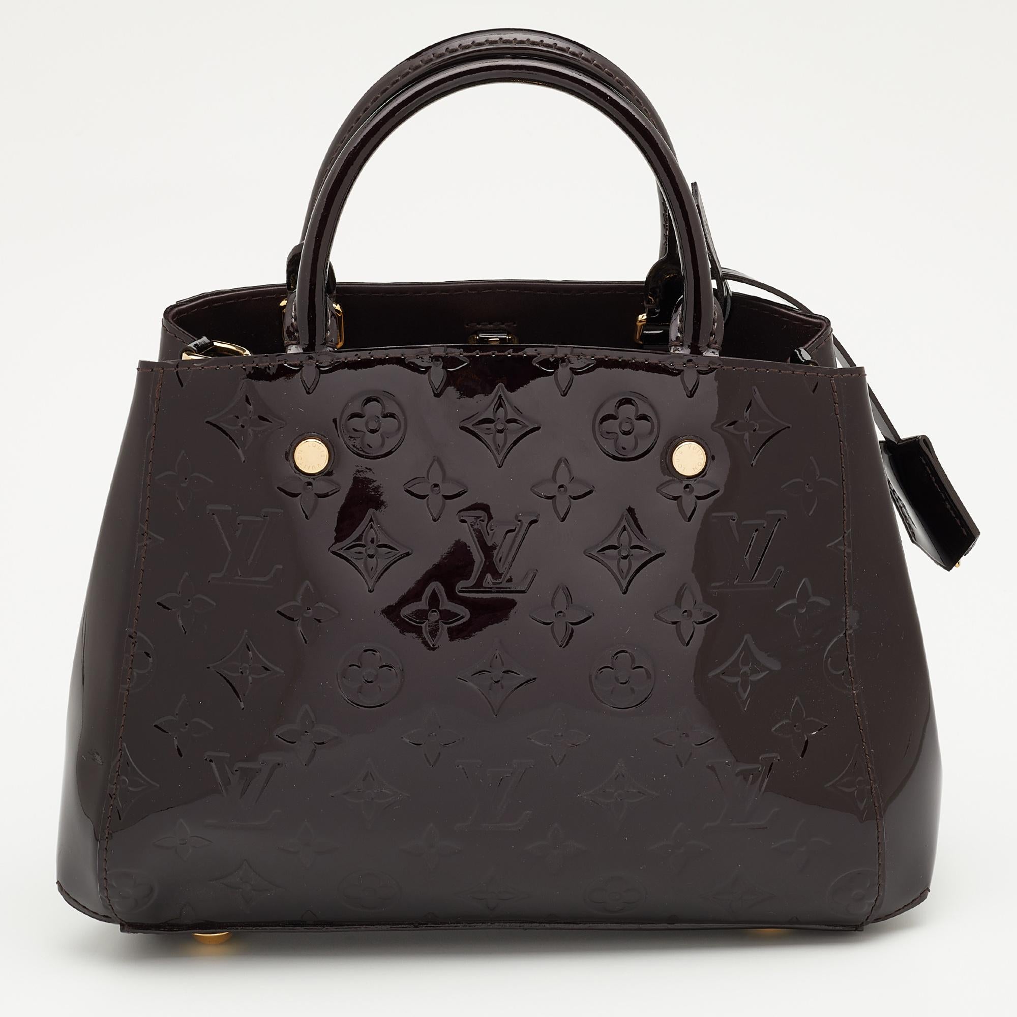A handbag should not only be good-looking but also functional, just like this Montaigne bag from Louis Vuitton. Crafted from Monogram Vernis leather, this gorgeous number has the signature logo-engraved push lock closure and a top zipper that opens