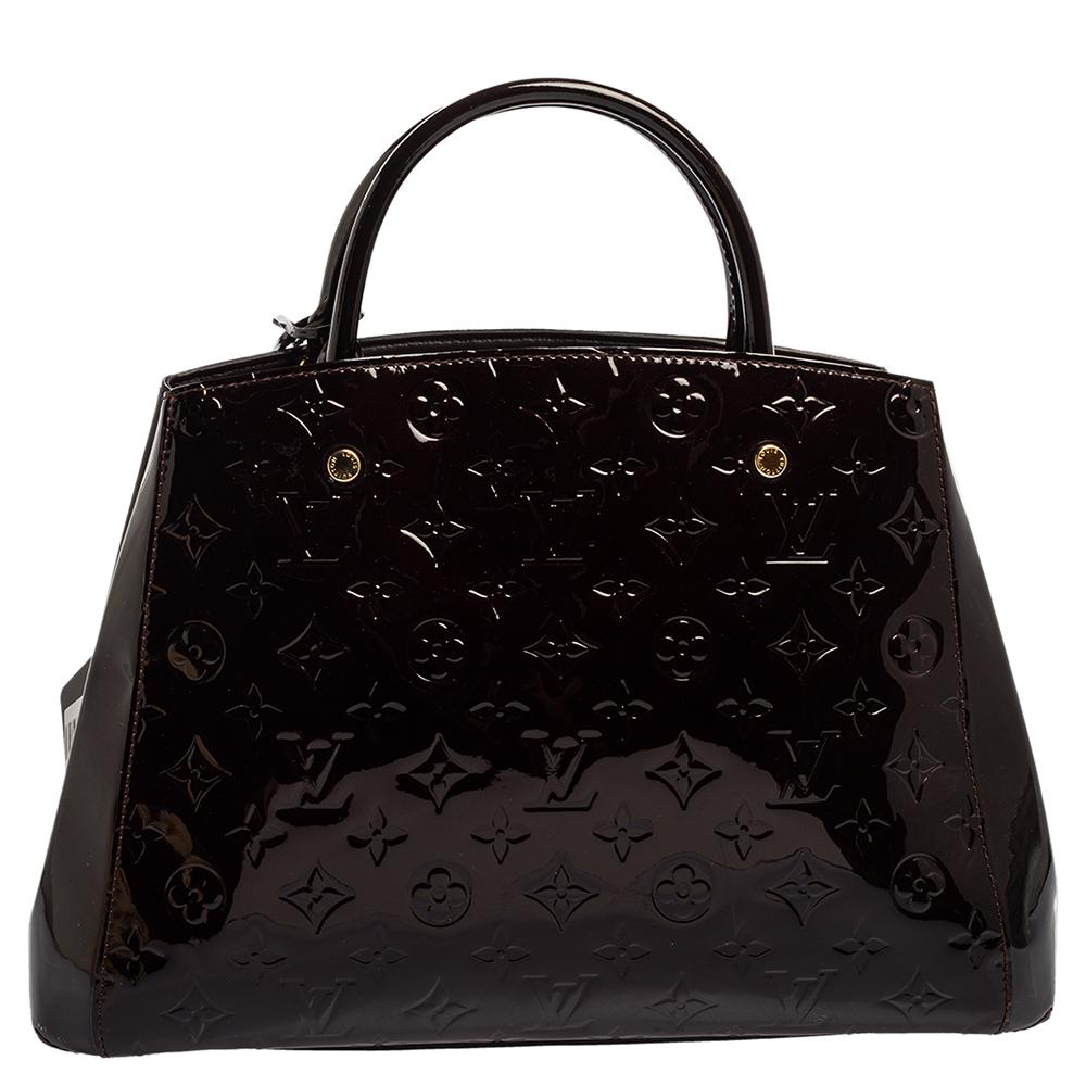 A handbag should not only be good-looking but also functional, just like this Montaigne bag from Louis Vuitton. Crafted from Monogram Vernis leather, this gorgeous number opens up to a spacious fabric interior. It features two rolled handles and