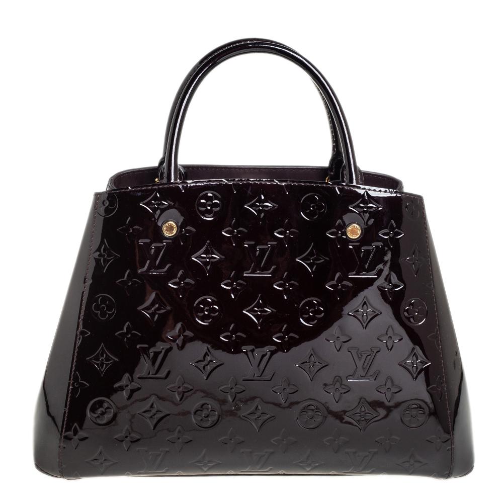 A handbag should not only be good-looking but also functional, just like this Montaigne bag from Louis Vuitton. Crafted from Monogram Vernis, this gorgeous number opens up to a spacious fabric interior. It features two rolled handles, a shoulder