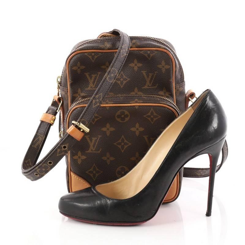 This authentic Louis Vuitton Amazone Bag Monogram Canvas is perfect to add to your daytime wardrobe. Constructed with brown monogram coated canvas, this crossbody bag features a long adjustable strap with leather pad, front zip pocket, and gold-tone