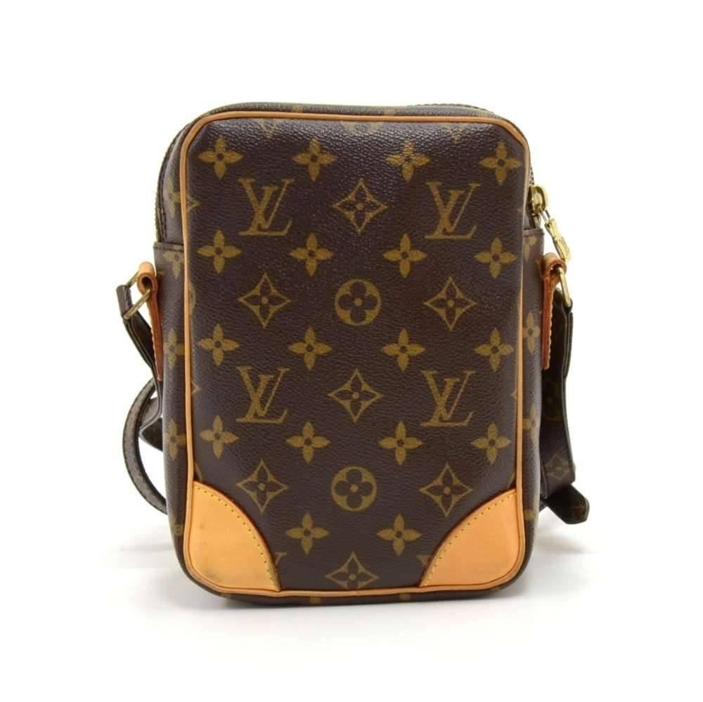 Authentic Louis Vuitton Amazone shoulder bag in monogram Canvas. Outside, it has 1 zipper pocket in front. Top secured with zipper. Inside has 1 open pocket.  Can be carried on the shoulder or across the body with the adjustable strap. Very