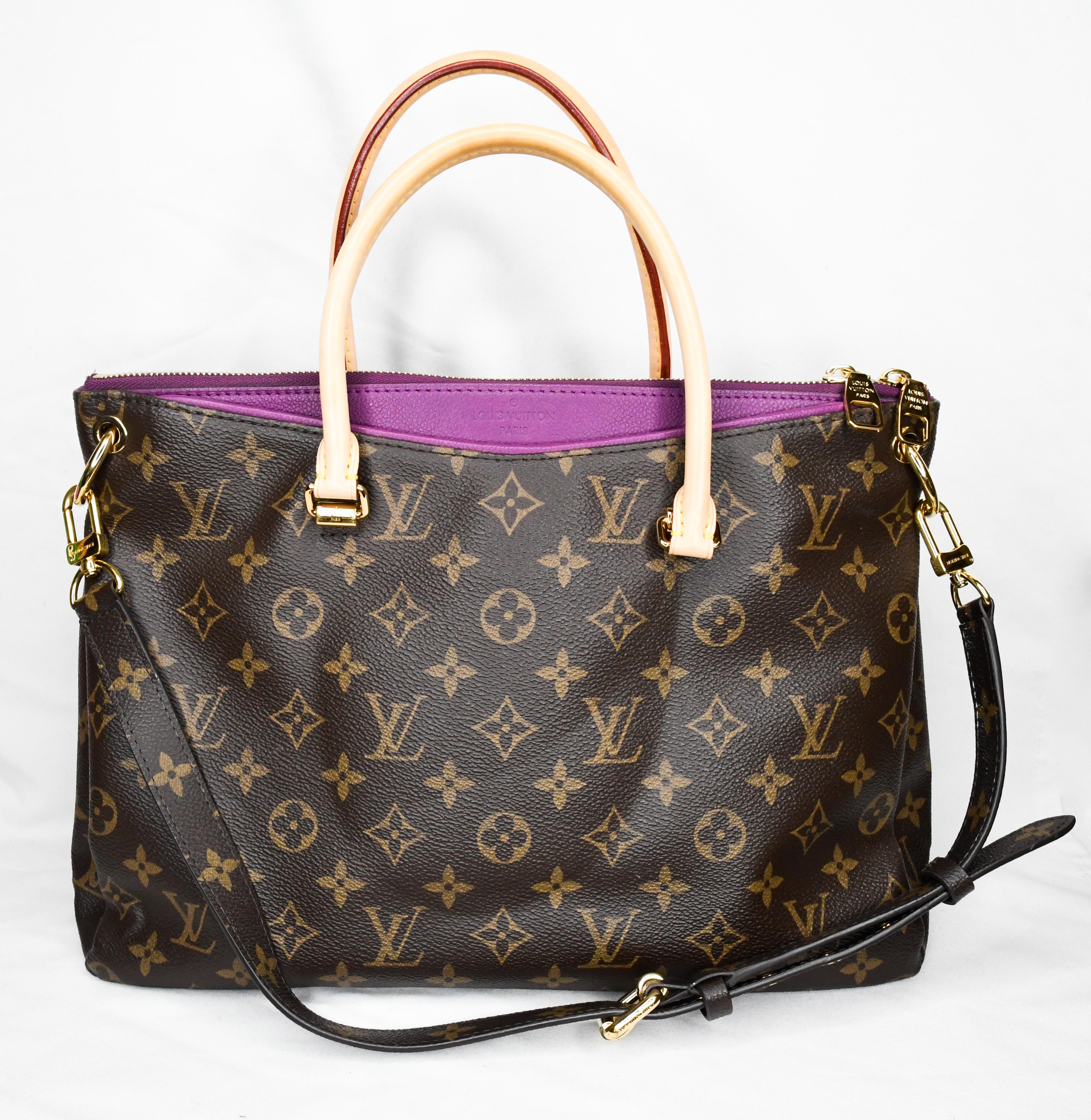 The exterior of this stunning Louis Vuitton features the house's iconic monogram canvas.  The accent of amethyst purple and gold tone hardware is so today!  Great pop of color!  No shortage of space for everything with roomy interior and two