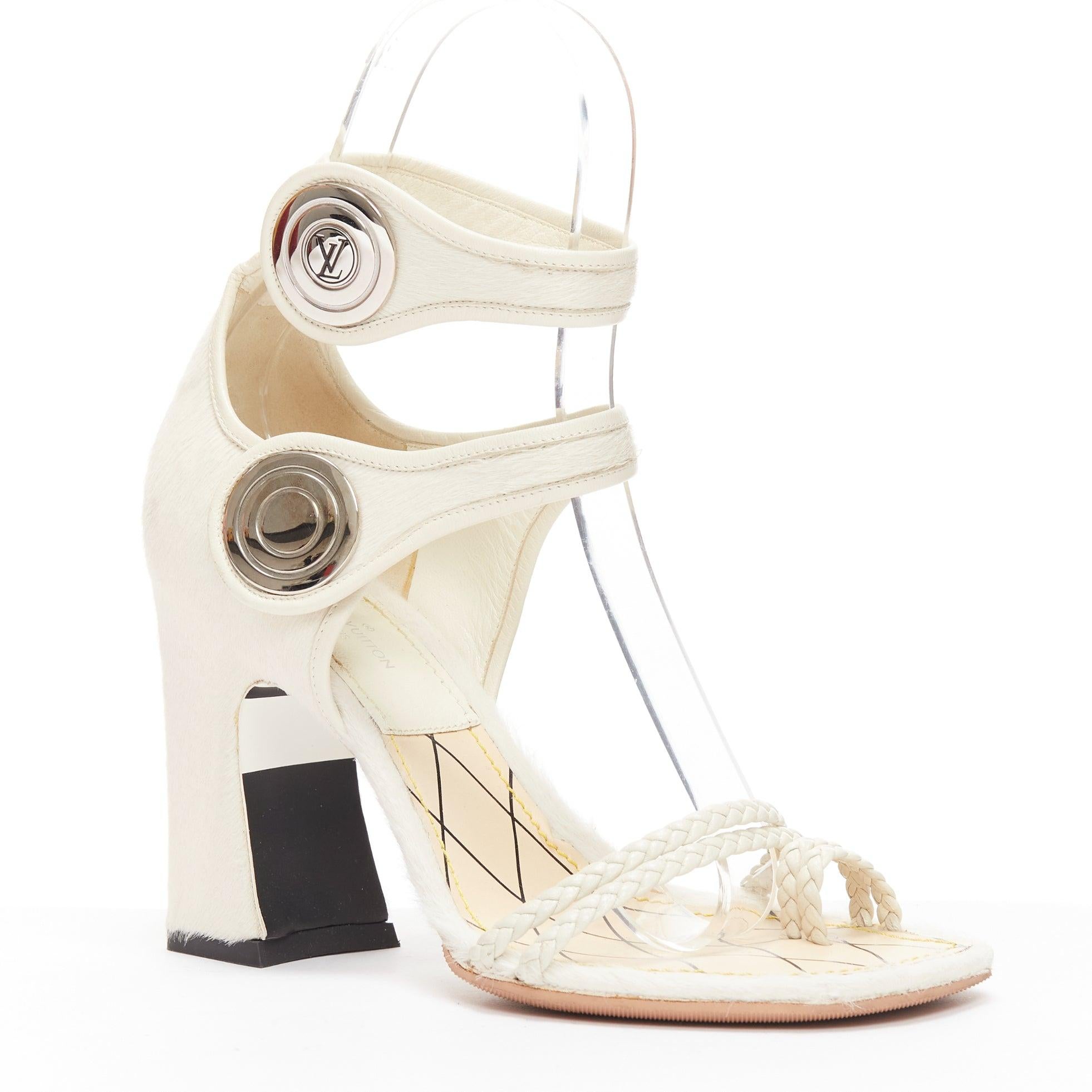 LOUIS VUITTON Anaconda white calf hair silver button braided chunky heel EU37
Reference: NKLL/A00122
Brand: Louis Vuitton
Designer: Nicolas Ghesquiere
Model: Anaconda
Collection: 2015
Material: Calf Hair
Color: White
Pattern: Solid
Closure: Ankle