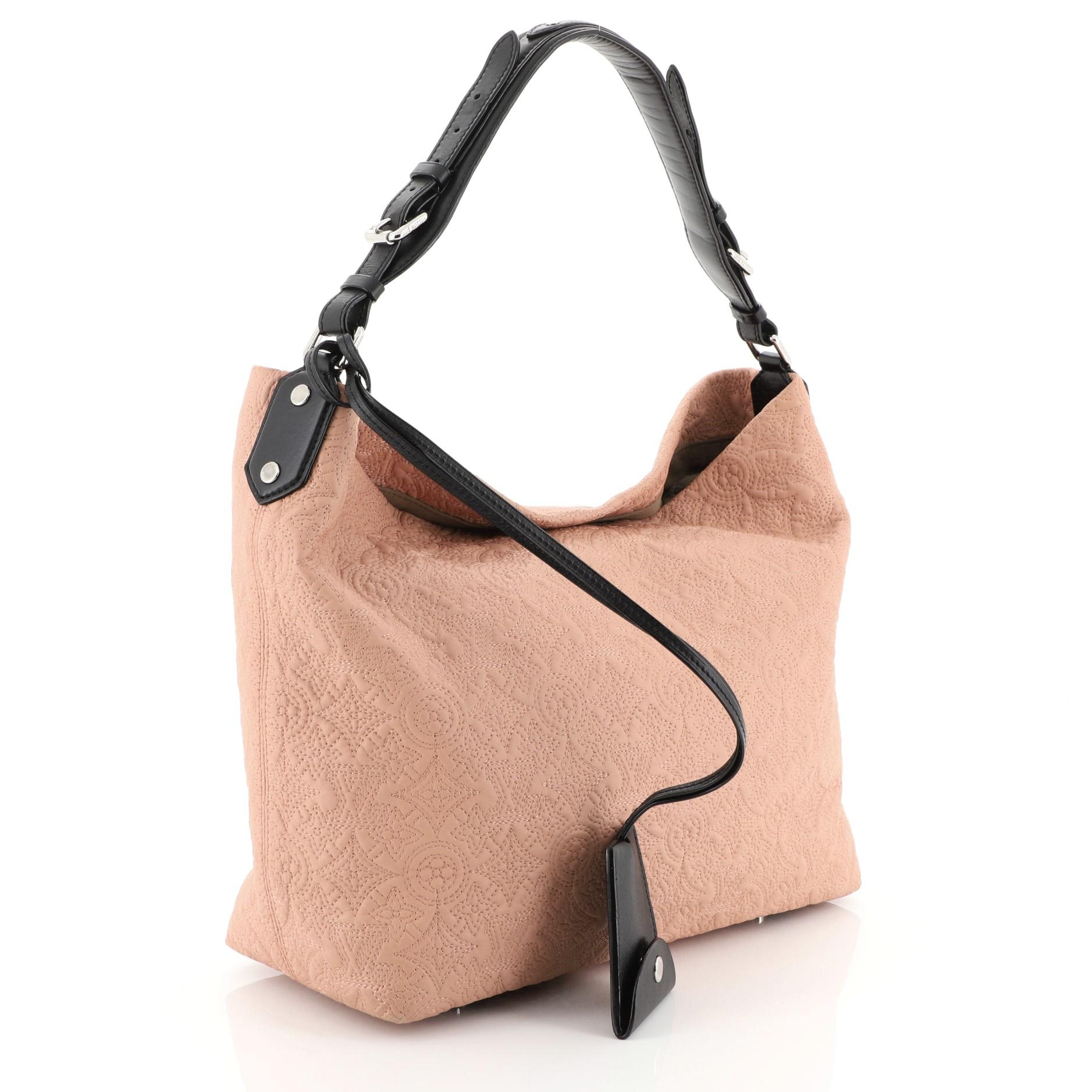 This Louis Vuitton Antheia Hobo Leather PM, crafted from pink leather, features a leather top handle, monogram flower embossed stitching, and silver-tone hardware. It opens to a brown microfiber interior with zip and slip pockets. Authenticity code