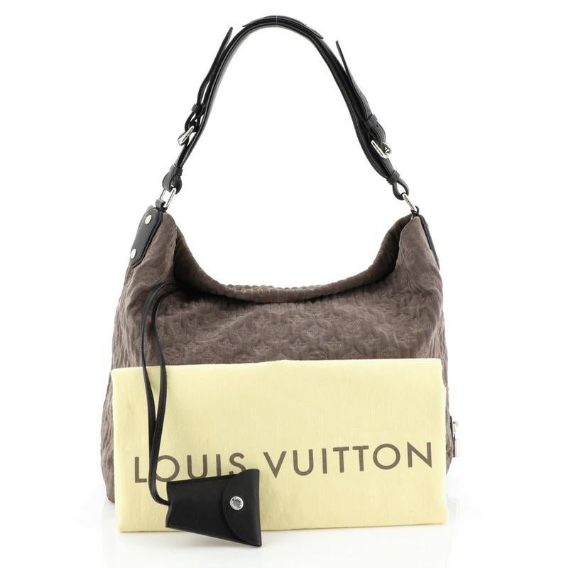 This Louis Vuitton Antheia Hobo Suede PM, crafted from gray suede, features a leather top handle, monogram flower embossed stitching, and silver-tone hardware. It opens to a black leather interior with zip and slip pockets. Authenticity code reads: