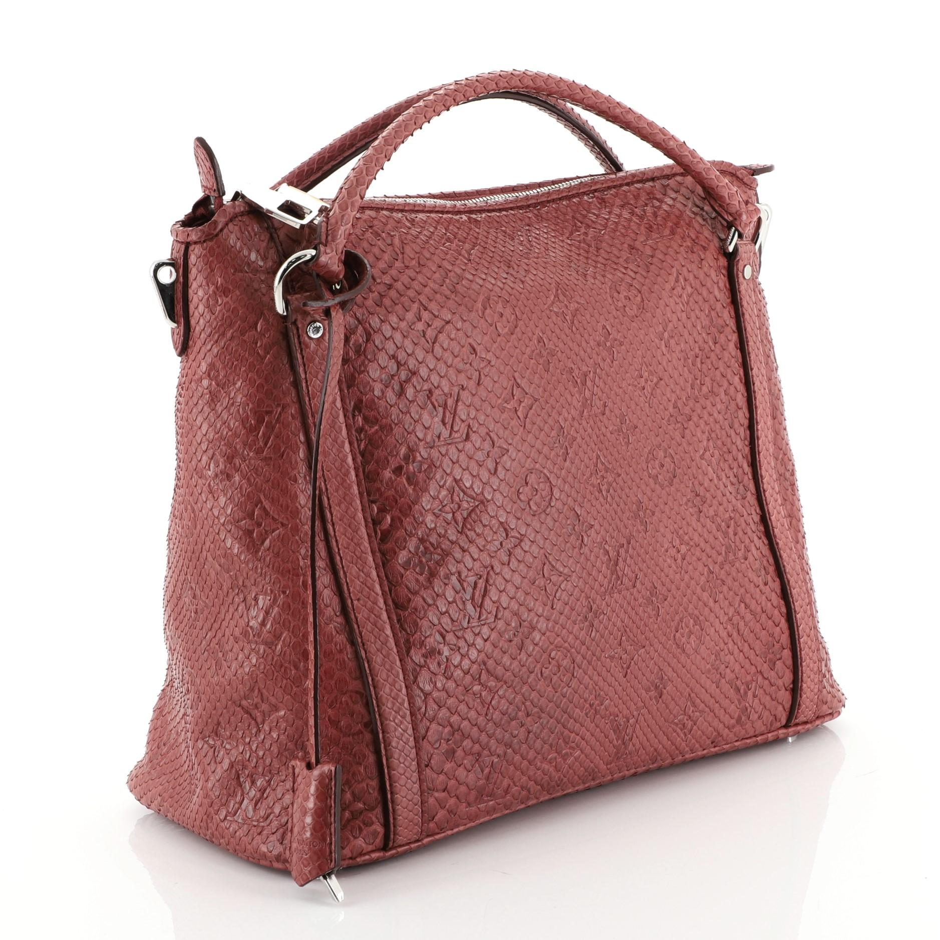 This Louis Vuitton Antheia Ixia Handbag Python PM, crafted in genuine red python, features dual rolled handles, monogram flower patterns, and silver-tone hardware. Its zip closure opens to a red leather interior with zip and slip pockets.