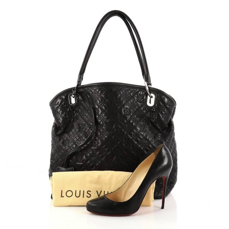 This authentic Louis Vuitton Antheia Lilia Handbag Leather GM is a luxurious and functional bag that's a must-have for LV collectors everywhere. Crafted in black leather embroidered with an ornate interpretation of the iconic monogram print, this