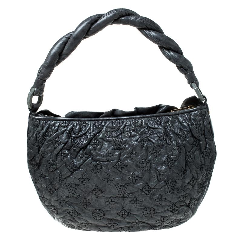 This hard-to-find Limited Edition Olympe Nimbus bag is a design marvel. Flawlessly crafted from Anthracite Monogram leather, it features a slouchy, chic look and a twisted handle. The bag is named after Mount Olympus and the intricate design is