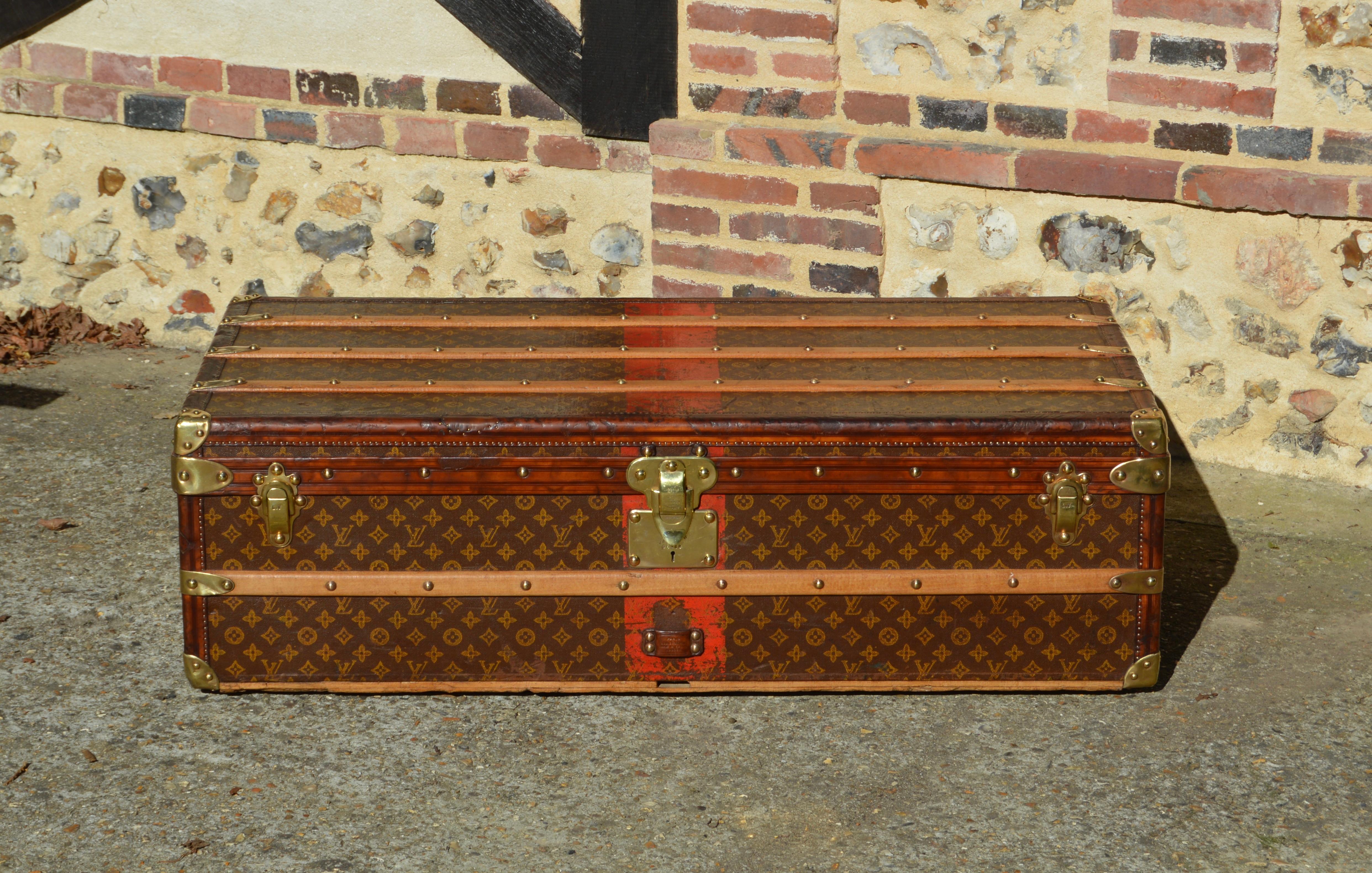 Rare Louis Vuitton Cabin Trunk from the 1910's in perfect condition, protected by leather edges, the most luxurious and fragile finish offered by Louis Vuitton until the 40's. Also included is the iconic stenciled monogram cotton canvas, as well as