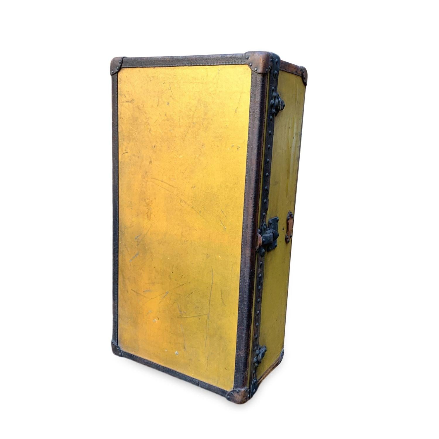 Step back in time and embrace a piece of history with this rare Louis Vuitton cabin travel trunk, dating back to the early 20th century (circa 1910-1920). Crafted from the iconic 'Vuittonite' canvas, this trunk showcases the craftsmanship and