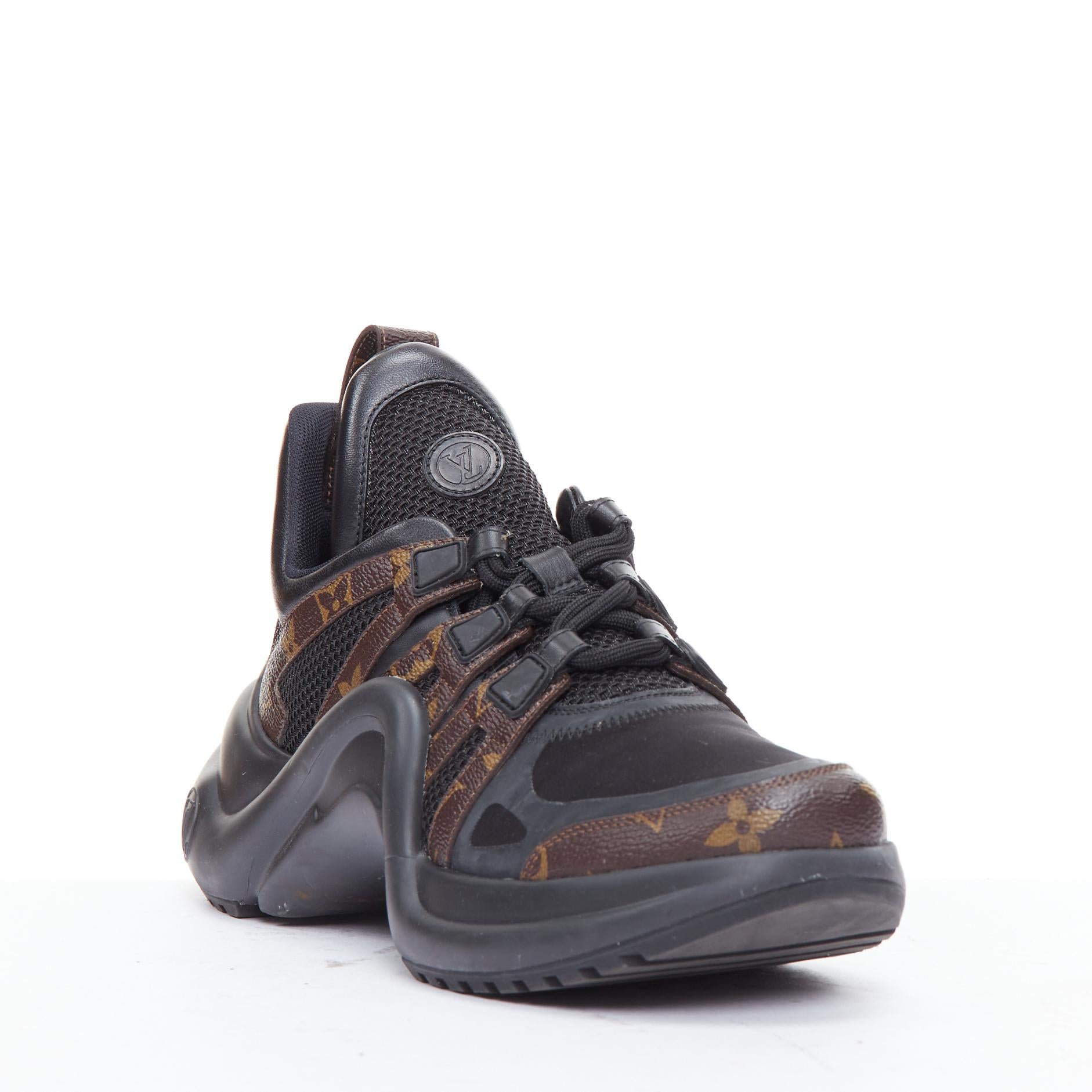 LOUIS VUITTON Archlight black LV monogram chunky sneakers EU39
Reference: ECLO/A00080
Brand: Louis Vuitton
Model: Archlight
Material: Fabric, Mesh
Color: Black, Brown
Pattern: Monogram
Closure: Lace Up
Lining: Black Fabric
Extra Details: The