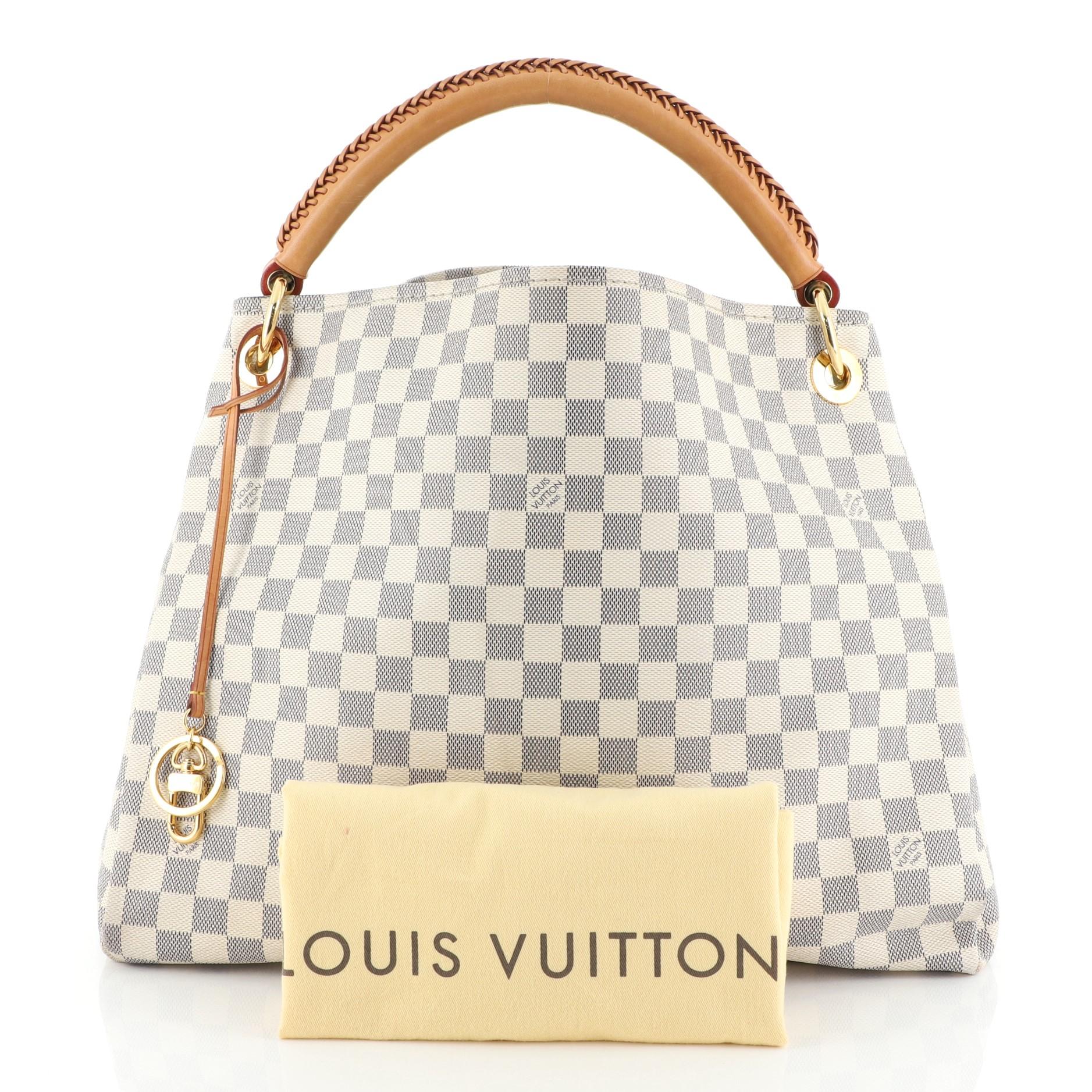 This Louis Vuitton Artsy Handbag Damier MM, crafted from damier azur coated canvas, features a rolled leather handle with braided detailing, protective base studs, and gold-tone hardware. It opens to a neutral microfiber interior with side zip and