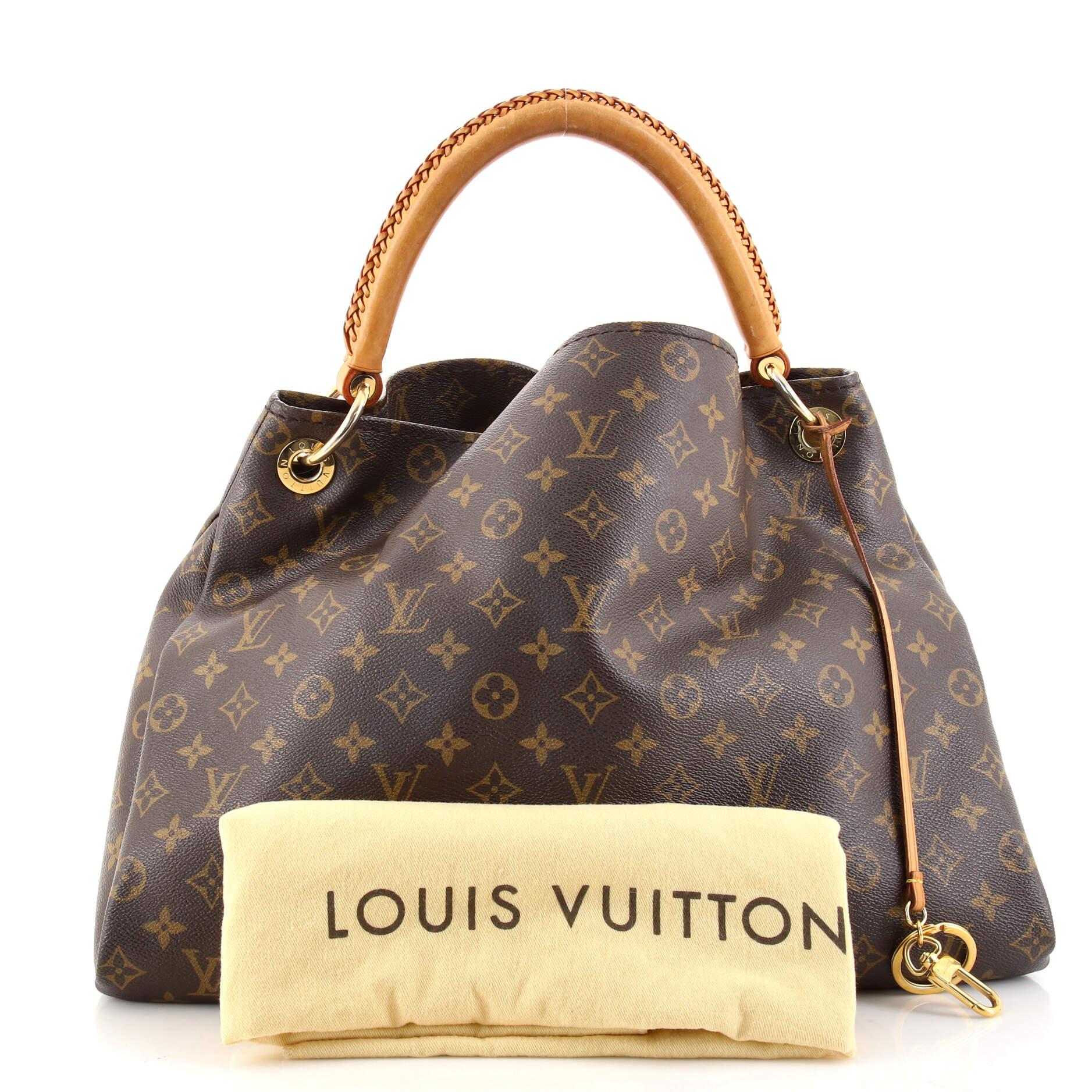 Condition: Fair. Heavy odor in interior. Creasing on exterior, wear on base corners, heavy darkening, watermarks, scuffs and wear on leather trims and handle. Moderate wear, marks and stains in interior, stiffness in interior pocket, scratches,