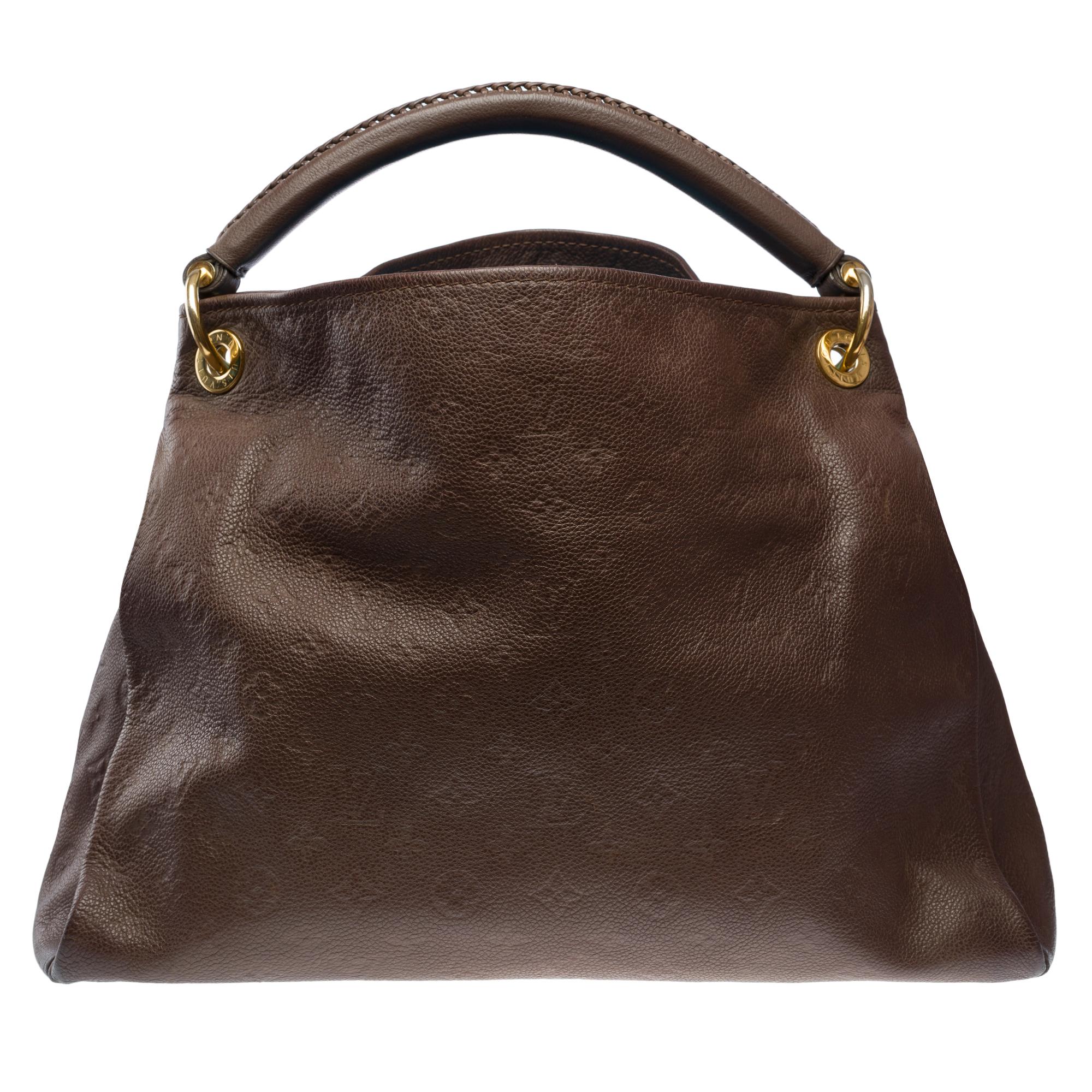 Magnificent​ ​Louis​ ​Vuitton​ ​Artsy​ ​MM​ ​Tote​ ​bag​ ​made​ ​from​ ​brown​ ​monogram​ ​embossed​ ​leather​ ​with​ ​gold-tone​ ​metal​ ​hardware,​ ​featuring​ ​a​ ​braided​ ​brown​ ​leather​ ​handle​ ​for​ ​hand​ ​or​ ​shoulder​ ​carry

Interior​