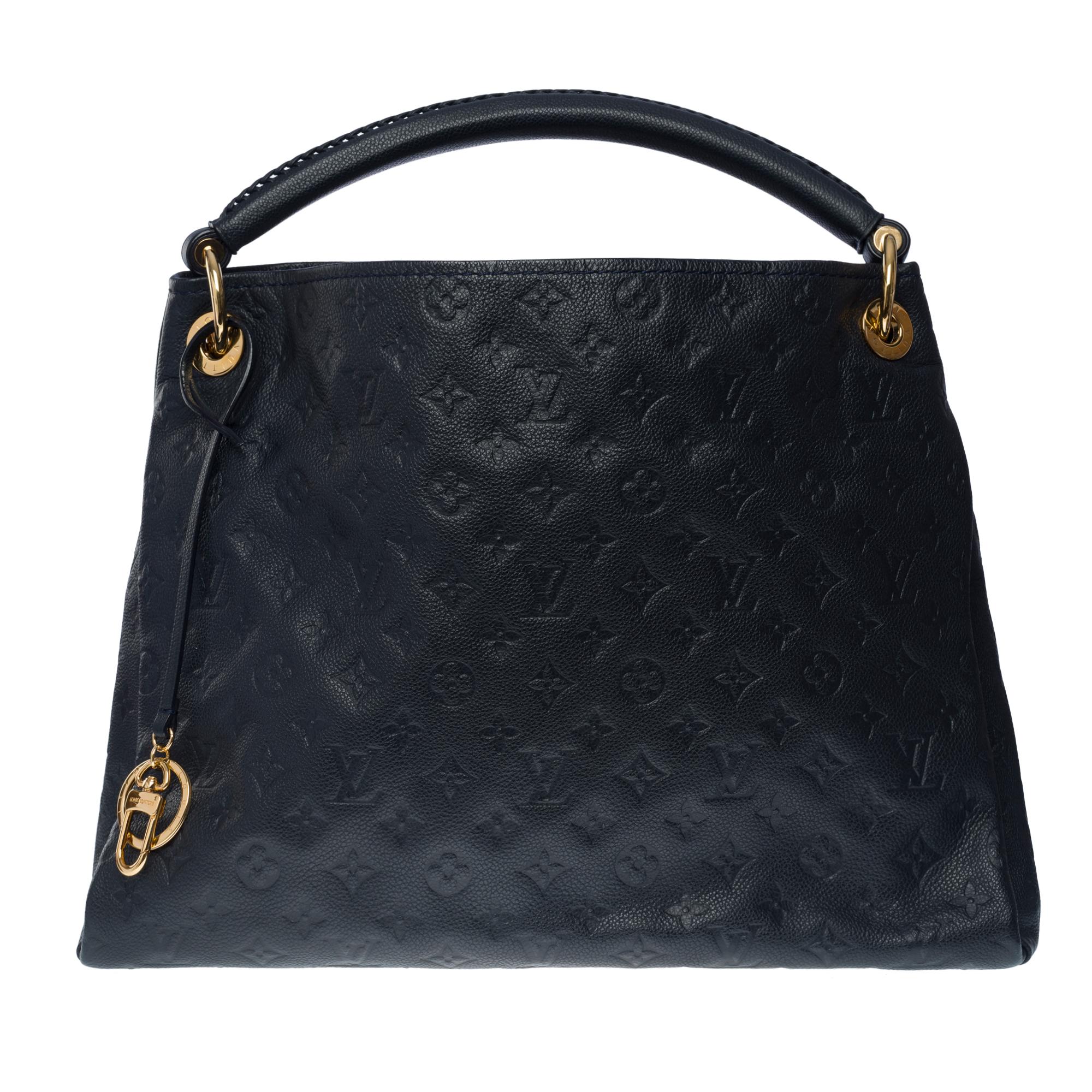 Gorgeous Louis Vuitton Artsy MM Hobo bag in dark blue print monogram leather, gold metal hardware, dark blue Braided leather handle

Navy striped canvas lining, one zippered pocket, 2 double patch pockets
Signature: 