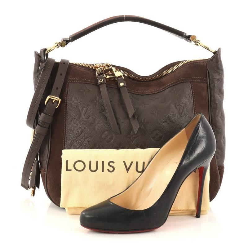 This authentic Louis Vuitton Audacieuse Handbag Monogram Empreinte Leather PM is a stylish and functional must-have for LV lovers. Crafted from a combination of brown monogram empreinte leather and suede, this glamorous hobo features a flat tall