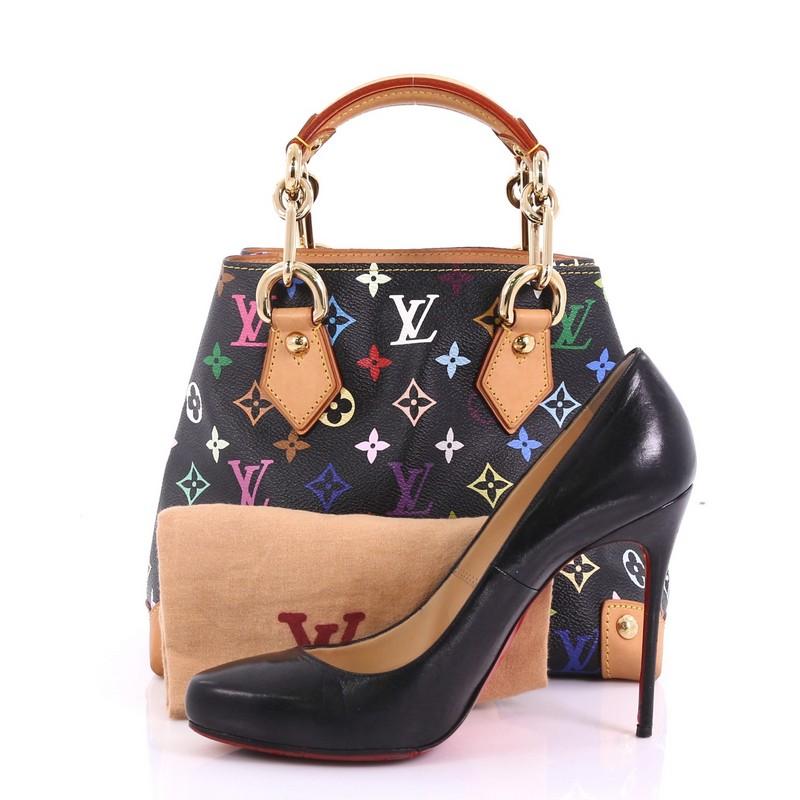 This Louis Vuitton Audra Handbag Monogram Multicolor, crafted from black monogram multicolor coated canvas with natural cowhide leather trims, features dual chain link handles with vachetta leather pads and gold-tone hardware. Its wide open top
