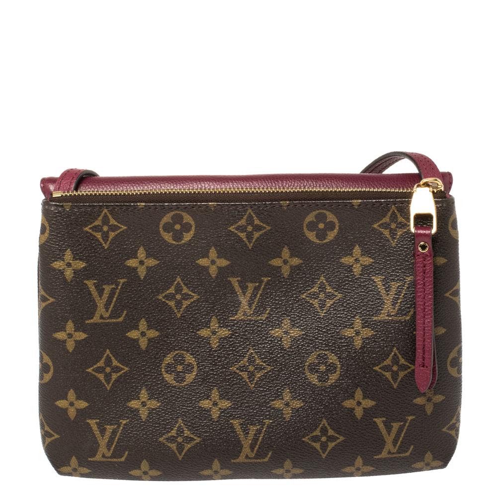 A two-in-one bag design by Louis Vuitton that's crafted from monogram coated canvas and leather. It has a flap compartment on the front and a zip compartment at the back. The Twinset bag for women is complete with gold-tone hardware and a shoulder