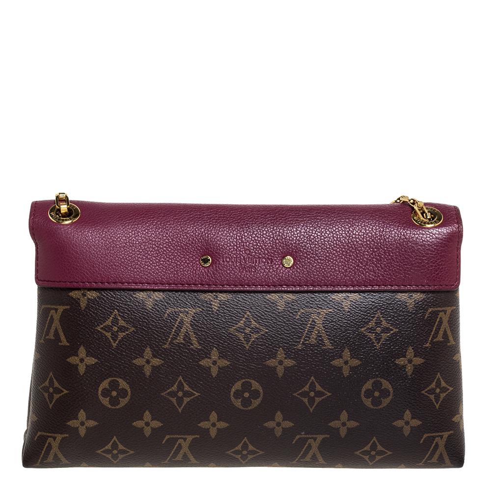 Accessorise like a pro with this trendy and functional bag from Louis Vuitton. This rich and classy Pallas bag is made from monogram coated canvas and leather into a smart silhouette. The inside of the bag is lined with Alcantara that has a smooth