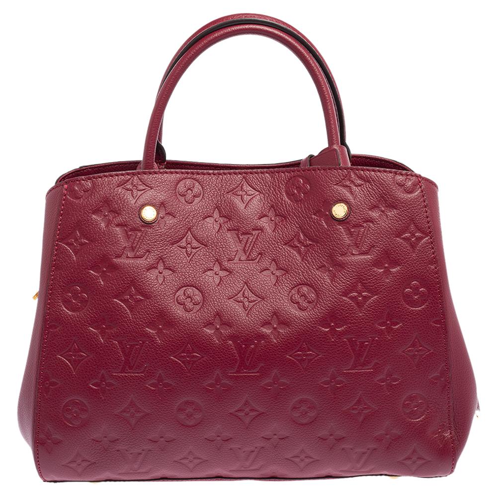 A handbag should not only be good-looking but also functional, just like this Montaigne bag from Louis Vuitton. Crafted from Monogram Empreinte leather, this gorgeous number opens up to a spacious canvas interior. It features two rolled handles and