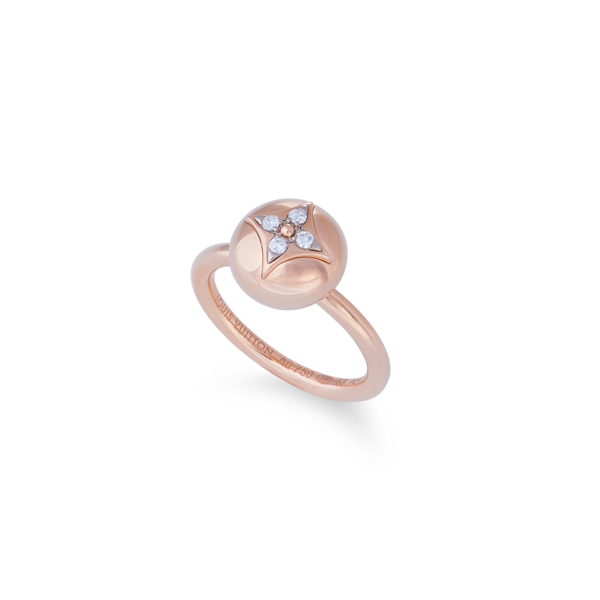 Authentic Louis Vuitton B Blossom ring crafted in 18 karat rose and white gold.  The iconic Louis Vuitton monogram flower is adorned with four stunning round brilliant cut diamonds of approximately 0.07 carats total weight.  Size 53, US size 6 1/4. 