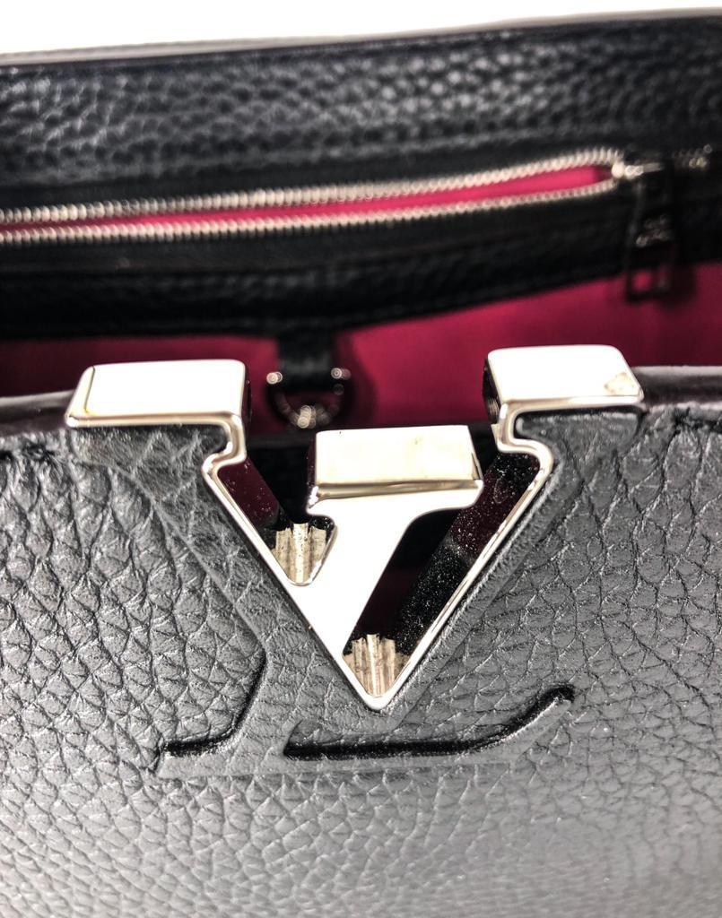 Louis Vuitton BB Capucines  taurillon leather - silver metal parts.
The Capucines BB comes with a removable long shoulder strap for casual shoulder or cross-body wear.