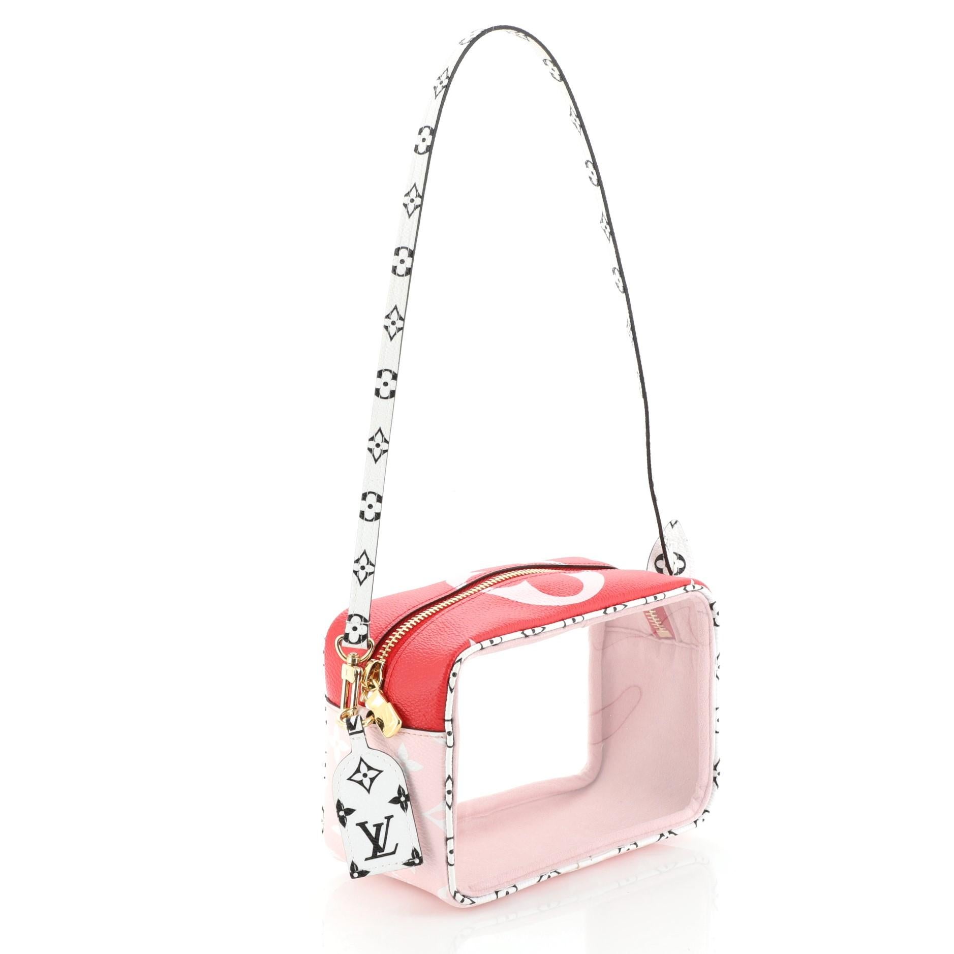 This Louis Vuitton Beach Pouch Limited Edition Colored Monogram Giant, crafted from pink and multicolor monogram coated canvas and PVC, features a flat top handle and gold-tone hardware. Its zip closure opens to a pink microfiber and PVC interior.
