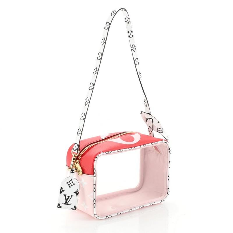 This Louis Vuitton Beach Pouch Limited Edition Colored Monogram Giant, crafted from red and pink monogram coated canvas and PVC, features a flat top handle and gold-tone hardware. Its zip closure opens to a pink microfiber and PVC interior.