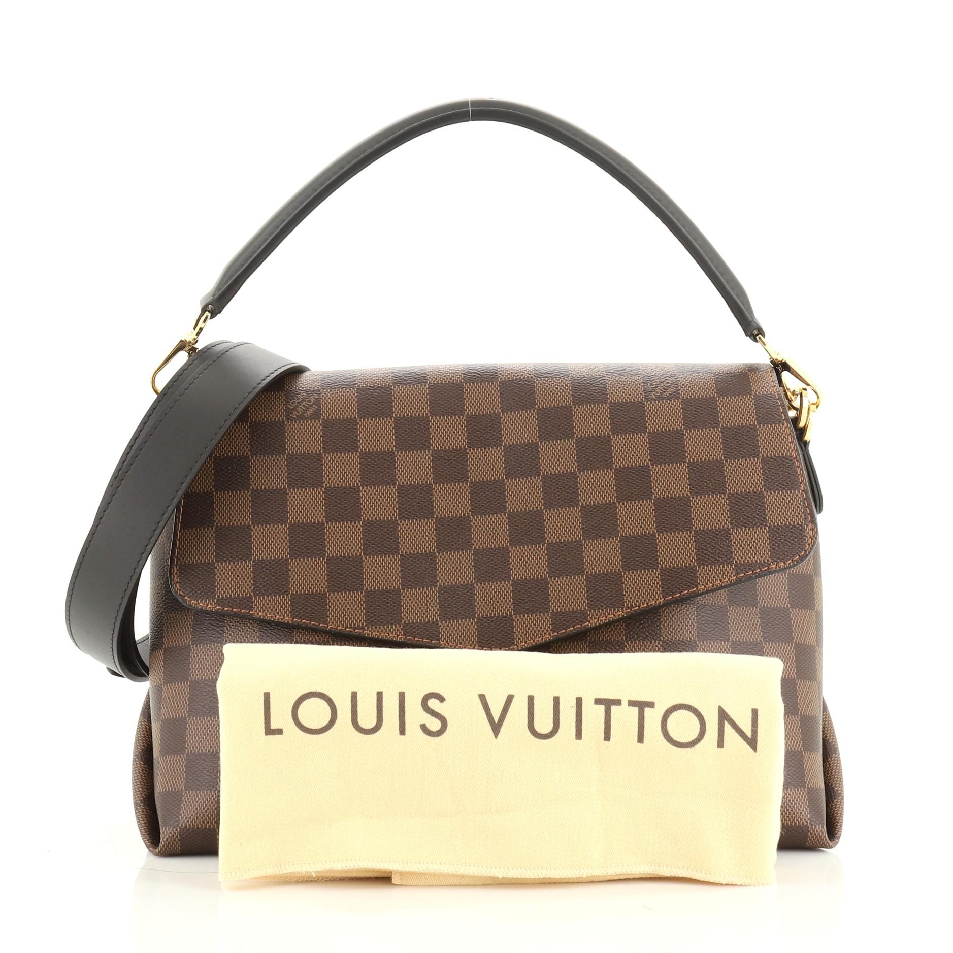 This Louis Vuitton Beaubourg Handbag Damier MM, crafted in Damier ebene coated canvas, features envelope style flap, a flat leather handle, and gold-tone hardware. Its magnetic snap closure opens to a black microfiber interior with slip pockets.