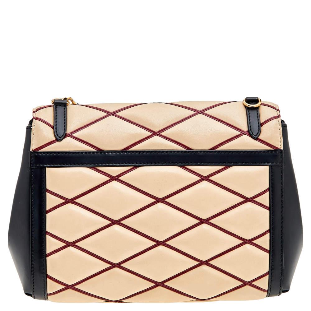 It is every woman's dream to own a Louis Vuitton handbag as appealing as this one. Coming from Louis Vuitton, this Malletage Pochette bag brings never-ending grace and poise to your style. It is made from beige-black leather with a gold-toned