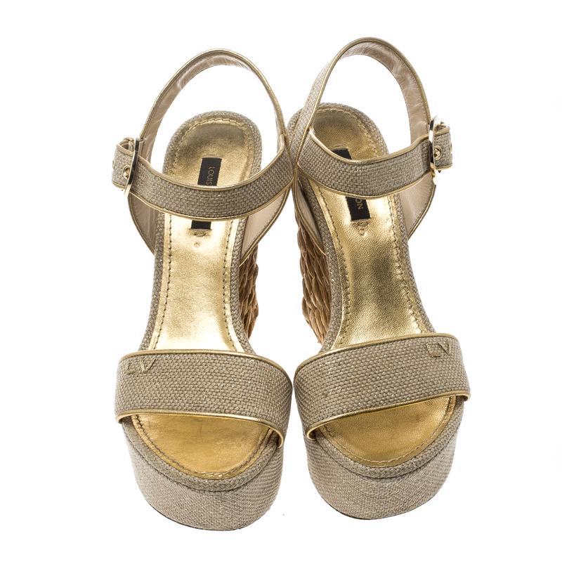 These beige sandals from Louis Vuitton are ultra feminine and spell unapologetic glamour. These stunning Tuileries are crafted from canvas and feature braided detailing on the wedge heels. They flaunt ankle straps, gold buckle detailing and leather