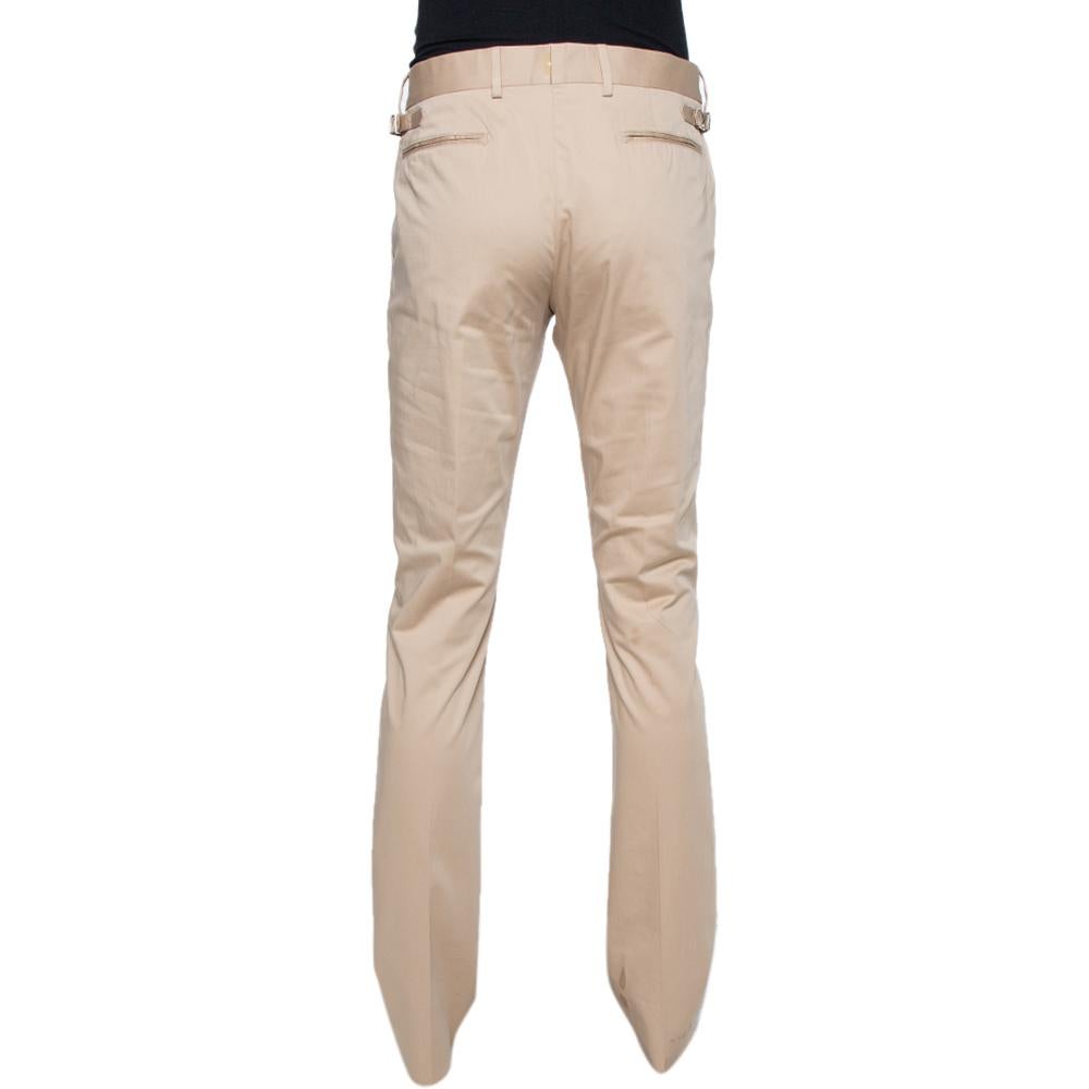 Trousers are an essential wardrobe staple, and these tailored ones from Louis Vuitton are sure to be an amazing addition to your collection! The beige trousers are made of cotton and feature a slim fit silhouette. They come equipped with front