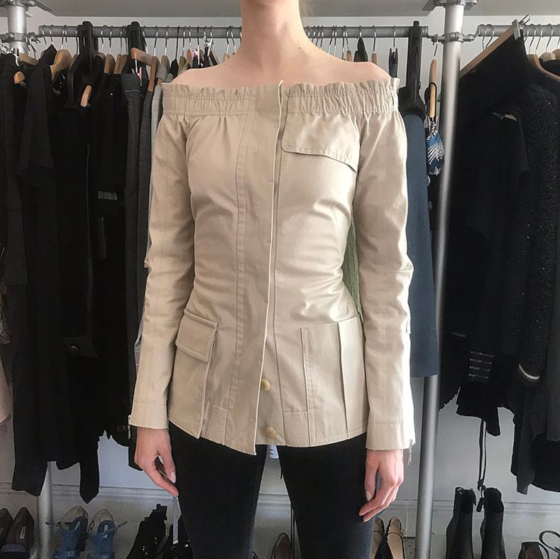 Louis Vuitton Beige Cotton Off Shoulder Fitted Jacket.  From the Spring 2007 runway. True color is like the second photo. Safari-style design with elasticized shoulder, fastens with hidden buttons, front hip pockets.  Corseted hook and eye detail at