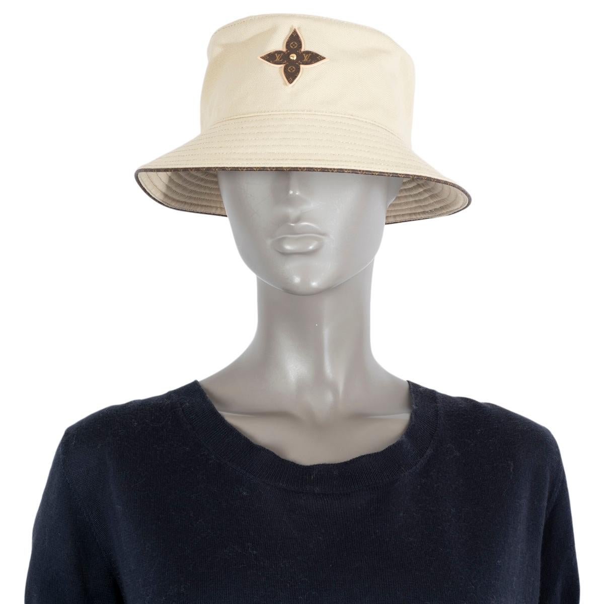 100% authentic Louis Vuitton On Your Way bucket hat in beige cotton (100%) with a leather LV monogram embellishment, LV monogrammed leather trim and matching fabric on the trim. Has been worn and is in excellent
