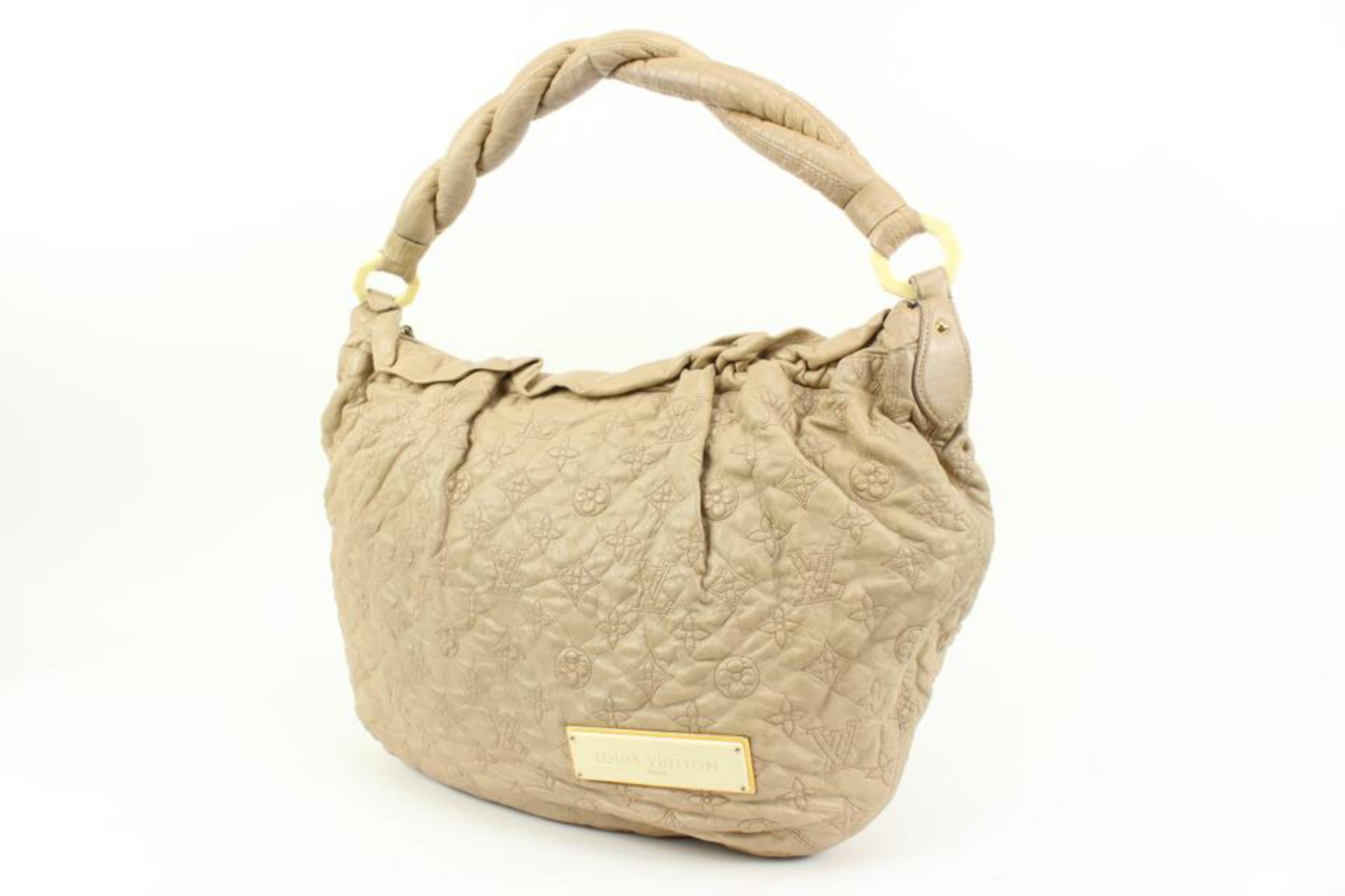Louis Vuitton Beige Ecru Monogram Leather Olympe Croissant Hobo 28lk324s
Date Code/Serial Number: RC0047
Made In: Italy
Measurements: Length:  19