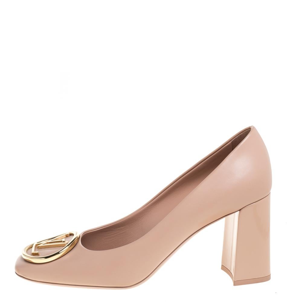 Beautifully blending fashion and comfort, these Madeleine pumps from Louis Vuitton are one of a kind! They are crafted from beige leather and styled with square toes and LV accents on the uppers. They are complete with comfortable leather-lined