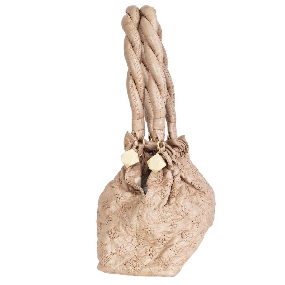  Louis Vuitton ' Stratus Olympe PM' Limited Edition bag in beige soft lambskin with intricate monogram stitched. featuring double braided ultra thick leather handles. Opens with a snap closure to a off-white microfibre lining with a zipper pocket