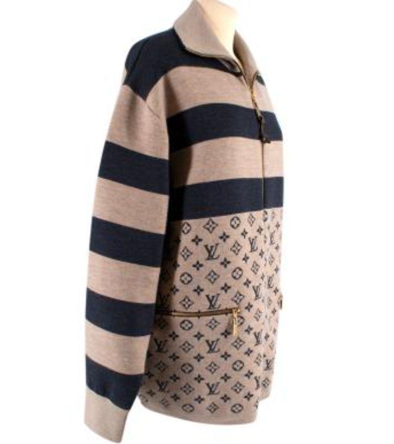 Louis Vuitton Beige & Navy Monogram Zip Up Jacket

-Zip up fastening 
-Monogram panels 
-Navy & beige constrast 
- Ribbed cuffs 
-Zip up pockets 
-Gold tone hardware 

Material: 

Cashmere 

Made in Italy 

PLEASE NOTE, THESE ITEMS ARE PRE-OWNED AND