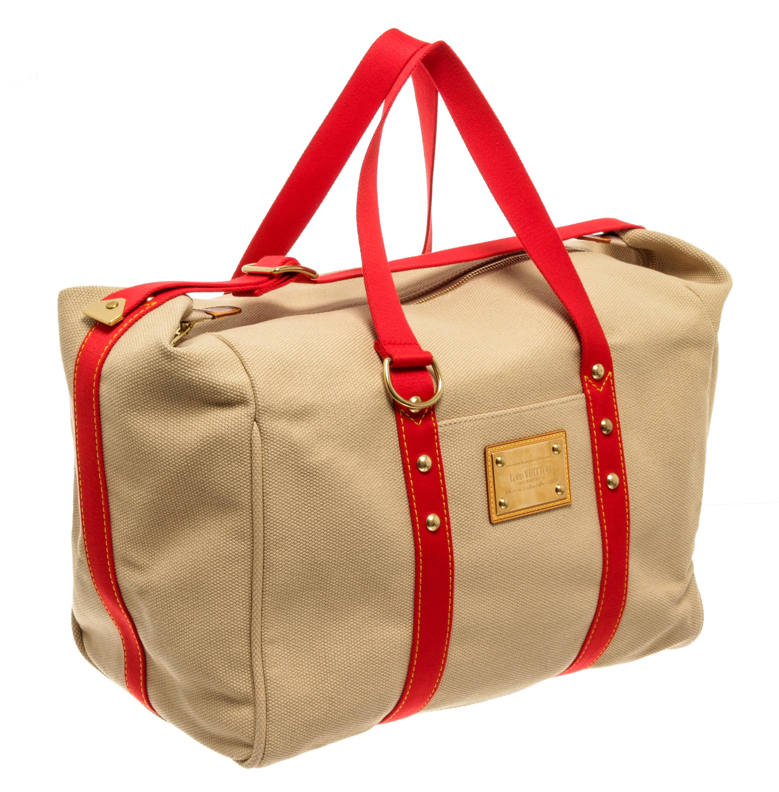 Louis Vuitton Beige Pink Canvas Sac Antigua Weekend Handbag. Features gold hardware, red canvas straps, a red fabric interior, and a gold zipper closure. 

65823MSC