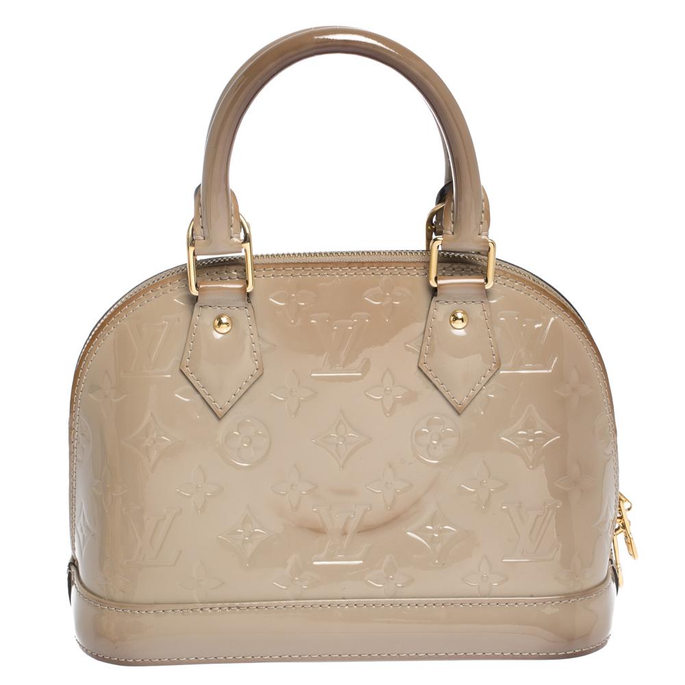 Out of all the irresistible handbags from Louis Vuitton, the Alma is the most structured one. First introduced in 1934 by Gaston-Louis Vuitton, the Alma is a classic that has received love from icons. This piece comes crafted from Monogram Vernis