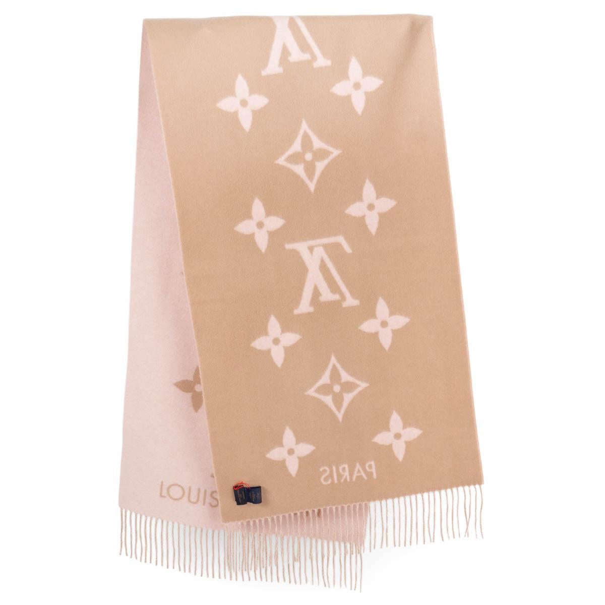 100% authentic Louis Vuitton Reykjavik extra-long scarf in pink and beige 100% cashmere features an enormous version of the house's famous Monogram pattern, accented by a Louis Vuitton Paris signature and delicate fringes at the ends. Has been worn