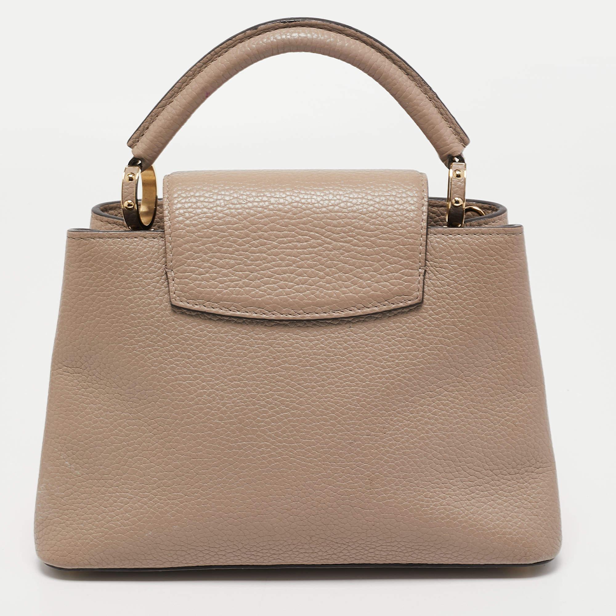 Crafted from leather, this LV Capucines BB features a structured design with a single handle and protective metal feet. While the front LV elevates its beauty, the leather interior will dutifully hold all your daily essentials.

Includes: Original