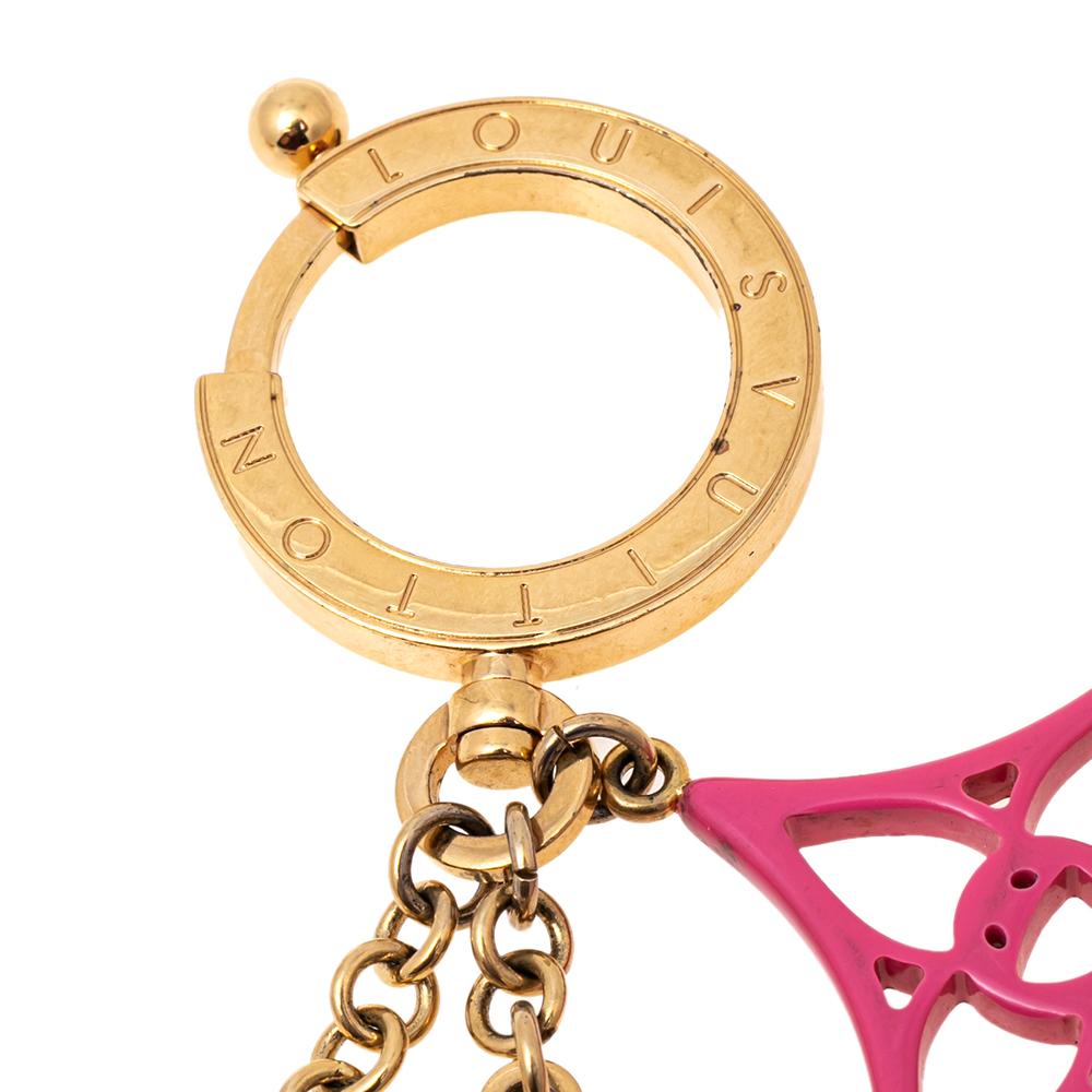 Louis Vuitton brings you this chic charm that has caught the eye of handbag lovers around the world. The key chain consists of the signature motifs with intricate detailing and is held by a chain strap with a gold-tone ring. Adorn your precious bags