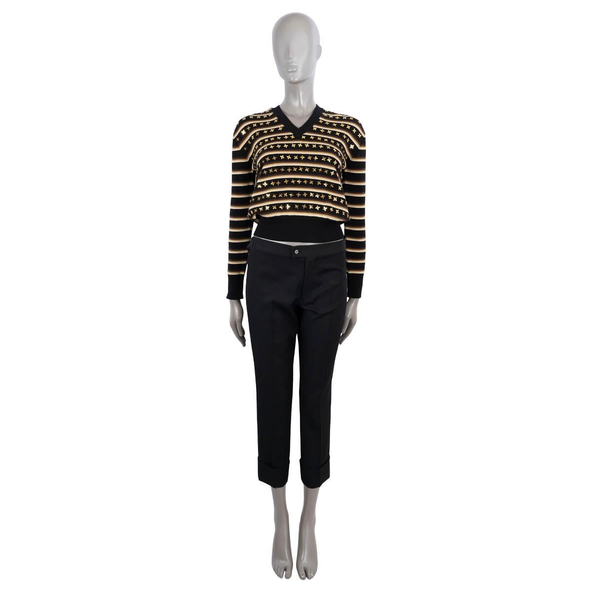 100% authentic Louis Vuitton star striped sweater in black wool (94%), polyamide (4%) and elastane (2%) with details in ivory, beige and browns. Features metallic gold Fleur de Lis sequins, a V-neck and ribbed cuffs and hem. Has been worn and is in