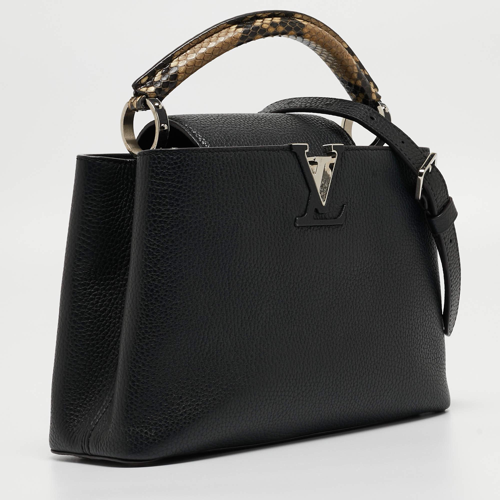 Your closet will always have space for this Louis Vuitton handbag as appealing as this one. Crafted from Taurillon leather, this Capucines BB bag features a structured design with a single python leather handle and protective metal feet. While the