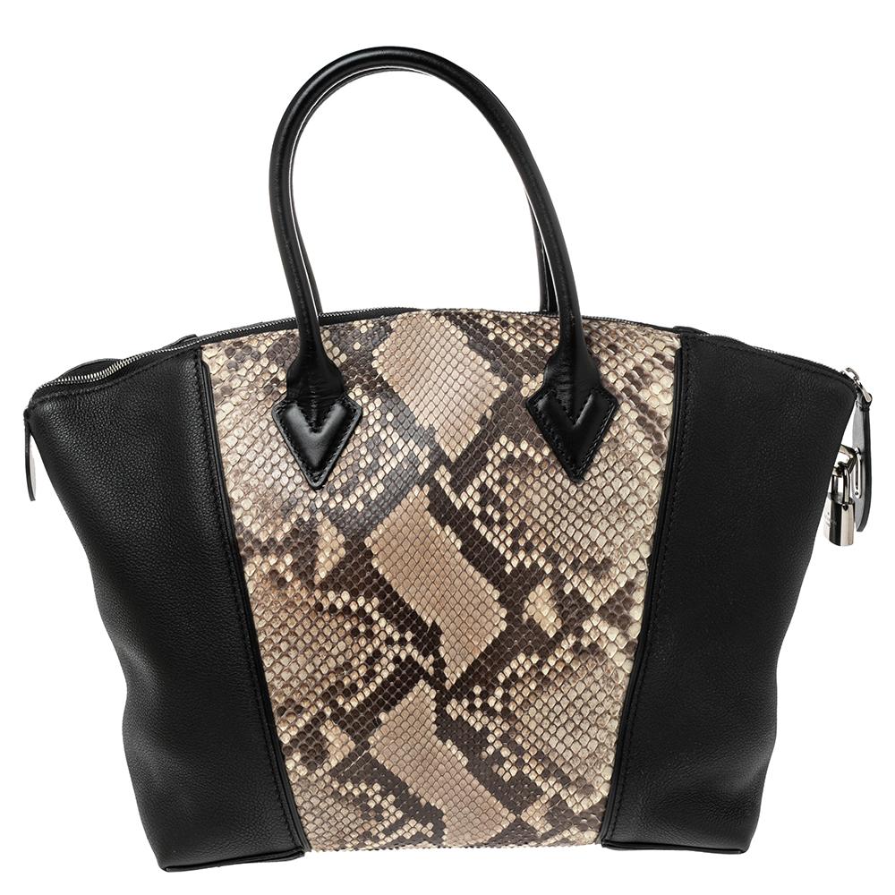 Louis Vuitton's handbags are popular owing to their high style and functionality. This Lockit bag, like all the other handbags, is durable and stylish. Crafted from python & Taurillon leather, the bag comes with two rolled top handles and a zipper