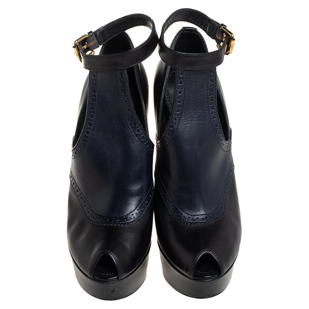 These booties from Louis Vuitton are chic and worth admiring! They have been crafted from leather and styled with peep-toes and ankle straps with a buckle fastening. They come equipped with comfortable leather-lined insoles and stand tall on